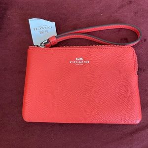 Bright Orange Coach Wristlet